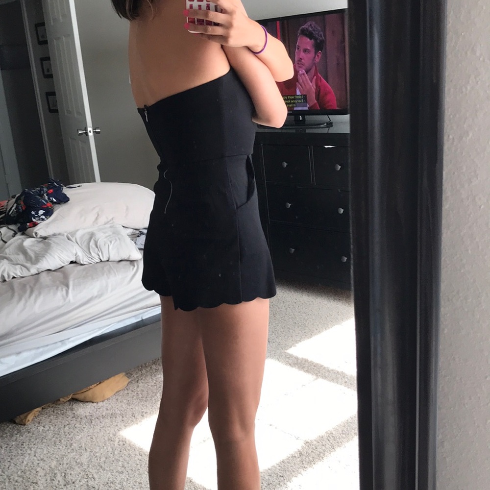 Black romper with scalloped detailing!